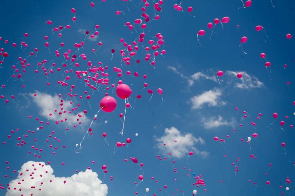 pink balloons show feeling happier